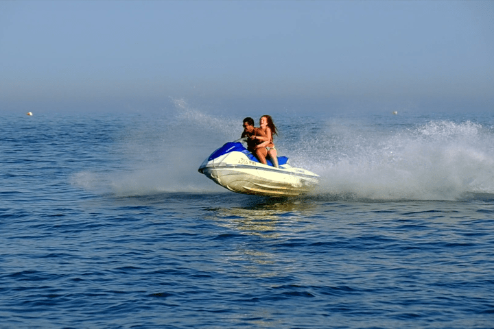 a man riding a wave on top of a body of water