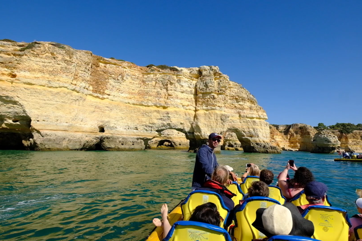 a group of people on a raft in a body of water