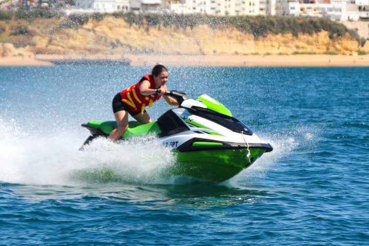 a man riding a wave on a surfboard in the water