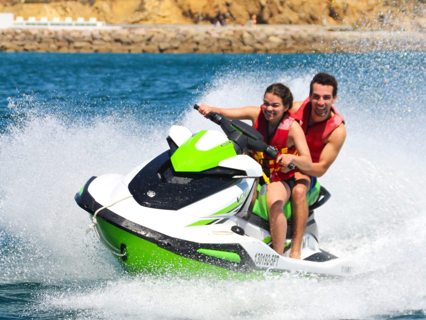 a man riding a wave on top of a body of water