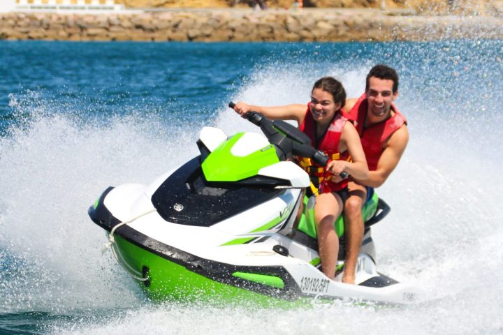 a man riding a wave on top of a body of water