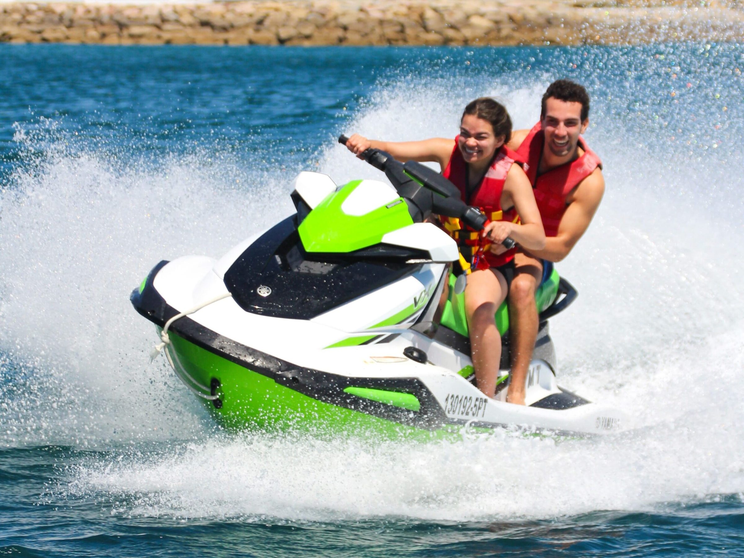 a man riding a wave on a surfboard in the water