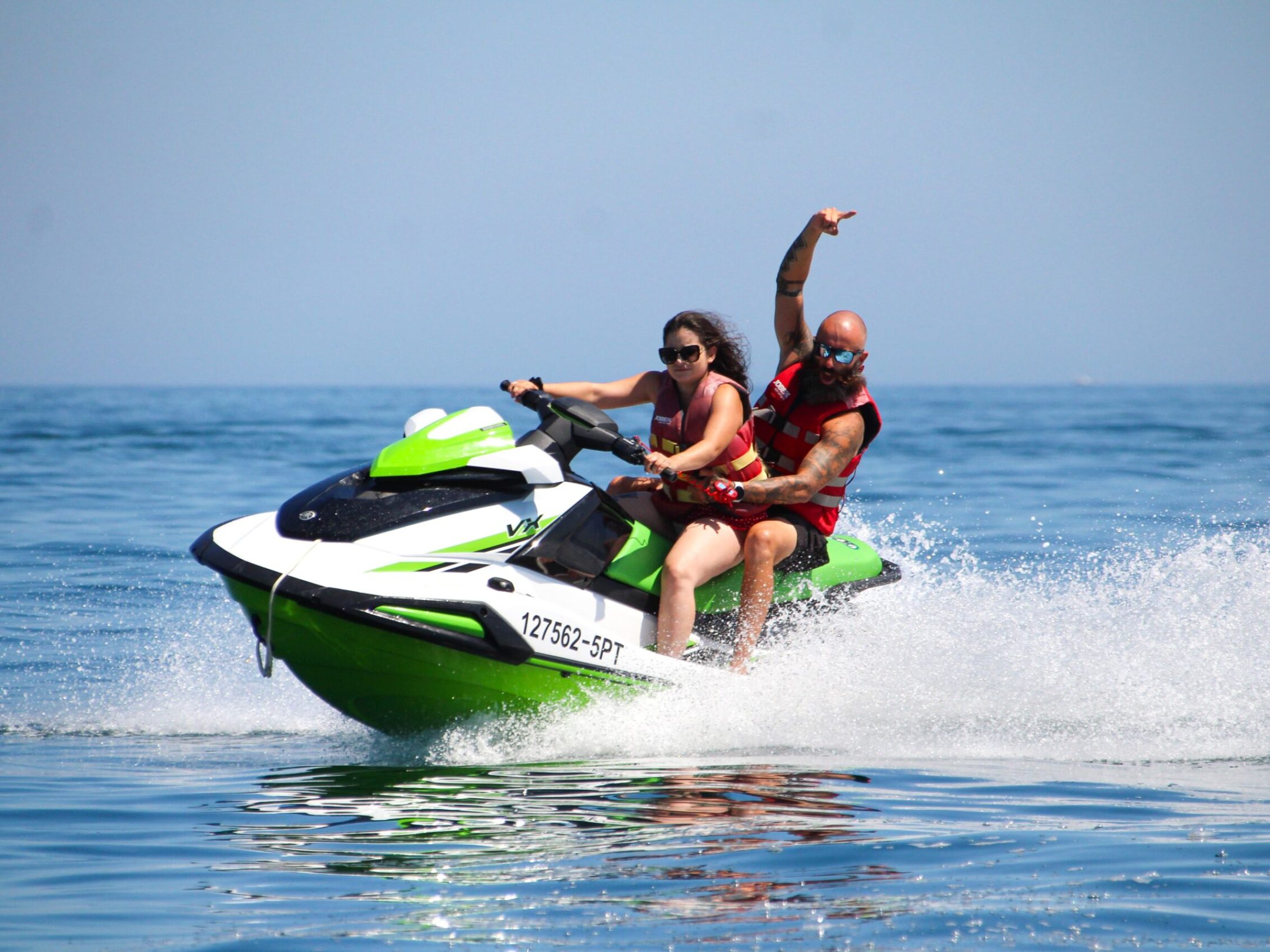 a girl riding a wave on a surfboard in the water
