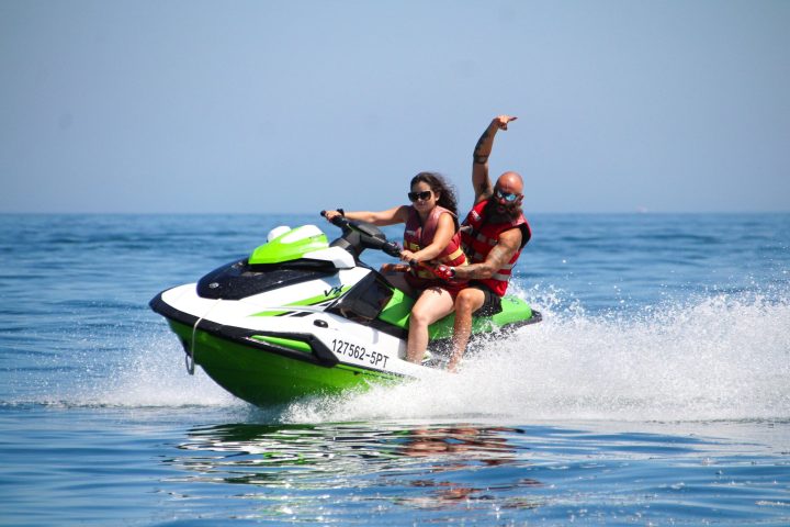 a girl riding a wave on a surfboard in the water