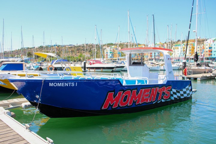 a boat is docked next to a body of water